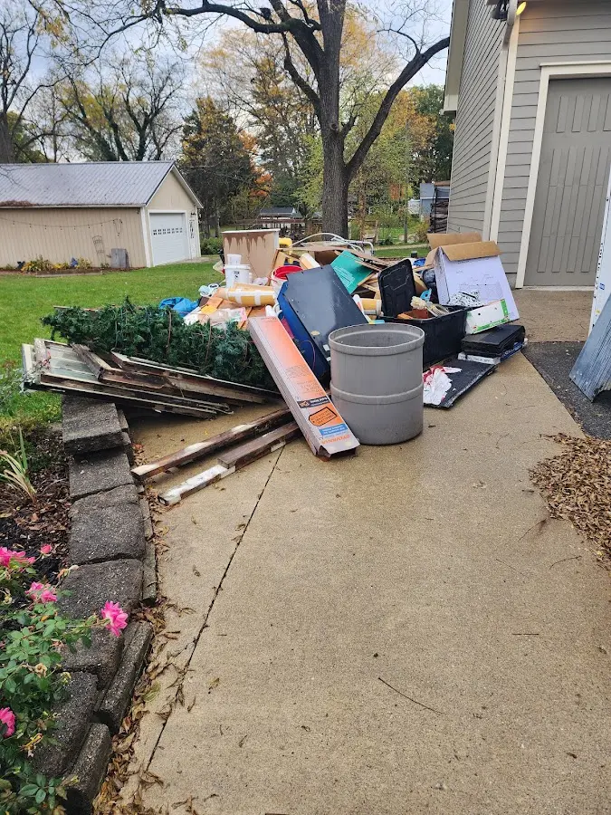 Dumpster being loaded with debris for Estate Cleanout Dumpster Rental in South Barrington